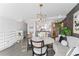 Elegant dining area features a marble table, stylish chairs, modern lighting, and sophisticated decor at 4950 Bayshore Blvd # 27, Tampa, FL 33611