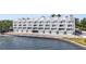 Stunning waterfront condo building with multiple balconies and covered parking spaces for residents at 4950 Bayshore Blvd # 27, Tampa, FL 33611