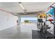 Spacious garage with epoxy flooring has an open garage door with waterfront views at 4950 Bayshore Blvd # 27, Tampa, FL 33611