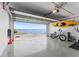 Spacious garage with epoxy flooring has an open garage door with waterfront views at 4950 Bayshore Blvd # 27, Tampa, FL 33611