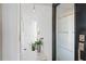 Bright hallway with marble floors, plant decor and modern lighting fixtures at 4950 Bayshore Blvd # 27, Tampa, FL 33611