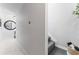Hallway leads to a flight of stairs, decorated with round mirror and modern accents at 4950 Bayshore Blvd # 27, Tampa, FL 33611