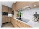 Gourmet kitchen features modern appliances, quartz countertops, custom cabinetry and under cabinet lighting at 4950 Bayshore Blvd # 27, Tampa, FL 33611