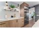 Bright kitchen features stainless steel appliances, marble countertops, and modern wood cabinetry at 4950 Bayshore Blvd # 27, Tampa, FL 33611