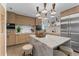 Modern kitchen with a marble island, stainless steel appliances, and stylish wood cabinetry at 4950 Bayshore Blvd # 27, Tampa, FL 33611
