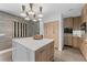 Modern kitchen with a marble island, designer lighting, and sleek wood cabinetry at 4950 Bayshore Blvd # 27, Tampa, FL 33611