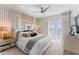 This stylish main bedroom features water views, an upholstered headboard, and luxurious décor at 4950 Bayshore Blvd # 27, Tampa, FL 33611