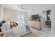 Bright main bedroom featuring water views from the french doors, light walls, and walk-in shower at 4950 Bayshore Blvd # 27, Tampa, FL 33611