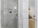 Elegant walk-in shower with a rainfall showerhead, built-in niche, and pristine glass door at 4950 Bayshore Blvd # 27, Tampa, FL 33611