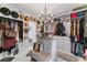 This custom walk-in closet features extensive storage and organization options at 4950 Bayshore Blvd # 27, Tampa, FL 33611