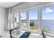 Water view from large windows and patio set; a serene escape at 4950 Bayshore Blvd # 27, Tampa, FL 33611