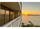 Balcony view of the sunset reflecting on the water, with a view of the city at 500 N Osceola Ave # 808, Clearwater, FL 33755