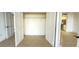 Bedroom with an open closet and doorways to the kitchen and another room at 500 N Osceola Ave # 808, Clearwater, FL 33755