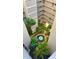 View looking down into the courtyard, featuring lush greenery, walkways, and a central fountain at 500 N Osceola Ave # 808, Clearwater, FL 33755