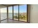 Bright living room featuring tile floors and large windows with beautiful water views and a balcony at 500 N Osceola Ave # 808, Clearwater, FL 33755