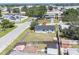 An aerial view showcasing a house with a fenced yard nestled in a community with mature trees at 5290 101St Ave, Pinellas Park, FL 33782
