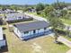 Bird's-eye view of the property featuring a fenced backyard, a well-kept lawn, and mature trees on a sunny day at 5290 101St Ave, Pinellas Park, FL 33782