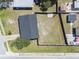 Aerial view showcasing a large backyard, a privacy fence, mature trees, and the overall property layout at 5290 101St Ave, Pinellas Park, FL 33782