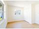 Bright bedroom with a large window and wood-look floors featuring a large closet at 5290 101St Ave, Pinellas Park, FL 33782