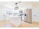 Bright kitchen with white cabinets, stainless steel appliances, and a center island at 5290 101St Ave, Pinellas Park, FL 33782