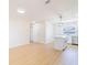 Bright living room adjacent to the modern kitchen, features large format floors at 5290 101St Ave, Pinellas Park, FL 33782