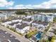 Bird's-eye view of a modern community featuring stylish townhomes, a refreshing pool, and beautifully landscaped common areas at 5351 Bridge St # 15, Tampa, FL 33611