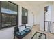 Comfortable balcony featuring a cozy bench and large windows for abundant light at 5351 Bridge St # 15, Tampa, FL 33611