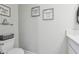 Bathroom featuring a toilet, vanity, decor, and neutral color palette at 5351 Bridge St # 15, Tampa, FL 33611