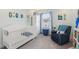 Charming Bedroom with a crib, comfortable seating, and light blue accents at 5351 Bridge St # 15, Tampa, FL 33611
