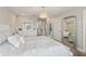 Bright bedroom with chandelier and an en suite with a beautiful mirror and dresser at 5351 Bridge St # 15, Tampa, FL 33611