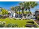 Relaxing community area featuring lounge chairs, outdoor games, tropical landscaping, and a refreshing pool at 5351 Bridge St # 15, Tampa, FL 33611