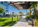 Inviting community pathway with pergola, lush landscaping, and waterfront views, perfect for leisurely strolls at 5351 Bridge St # 15, Tampa, FL 33611