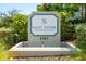 Elegant community sign reading 'Inlet Shore Westshore Marina District' with lush greenery and well-maintained landscaping at 5351 Bridge St # 15, Tampa, FL 33611
