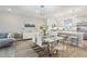 Modern dining area adjacent to a bright kitchen with modern appliances and decor at 5351 Bridge St # 15, Tampa, FL 33611