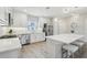 Modern kitchen with white cabinets, stainless steel appliances, and a large island with bar stool seating at 5351 Bridge St # 15, Tampa, FL 33611