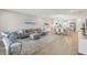 Bright open-concept living room with modern kitchen, comfortable seating, and stylish decor at 5351 Bridge St # 15, Tampa, FL 33611
