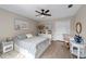 Cozy bedroom with nautical decor, luxury vinyl flooring and a ceiling fan at 5605 Glencrest Blvd, Tampa, FL 33625