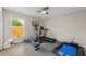 Home gym featuring an elliptical, treadmill, and weight bench at 5605 Glencrest Blvd, Tampa, FL 33625