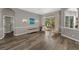 This formal living room provides ample space for sitting and conversation with views to the pool at 5605 Glencrest Blvd, Tampa, FL 33625