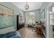 Well-lit office space with modern chandelier, shutters, wood floors, and stylish decor at 5605 Glencrest Blvd, Tampa, FL 33625