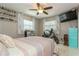 Relaxing bedroom with a ceiling fan, shelving decor, and a comfortable bed at 5638 13Th N Ave, St Petersburg, FL 33710