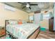 Charming bedroom with a unique corrugated metal ceiling, ceiling fan, and ample natural light at 5638 13Th N Ave, St Petersburg, FL 33710
