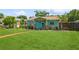 Charming single-story home with a lush green lawn and cheerful curb appeal at 5638 13Th N Ave, St Petersburg, FL 33710