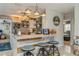 Inviting kitchen features bar seating, pendant lighting, and an open layout to another room at 5638 13Th N Ave, St Petersburg, FL 33710