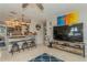 View of the living room adjacent to kitchen, showing TV and adjacent breakfast bar at 5638 13Th N Ave, St Petersburg, FL 33710
