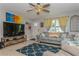 Cozy living room with comfortable seating and a large television for relaxation at 5638 13Th N Ave, St Petersburg, FL 33710