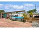 Backyard showcasing a pool, deck, patio, and privacy fence ideal for relaxing and entertaining at 5638 13Th N Ave, St Petersburg, FL 33710