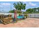 Backyard featuring a pool, deck, patio, and white privacy fence perfect for outdoor entertaining at 5638 13Th N Ave, St Petersburg, FL 33710
