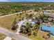 Wide aerial view of the property and surrounding neighborhood showcasing proximity to the water at 595 Denburn Ct, Englewood, FL 34223