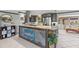Modern kitchen with stylish cabinetry, stone countertops, and stainless steel appliances at 595 Denburn Ct, Englewood, FL 34223